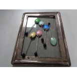 A silver photo frame together with a set of six silver enamelled teaspoons,