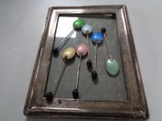 A silver photo frame together with a set of six silver enamelled teaspoons,