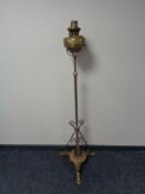 A 19th century copper and brass rise and fall standard oil lamp