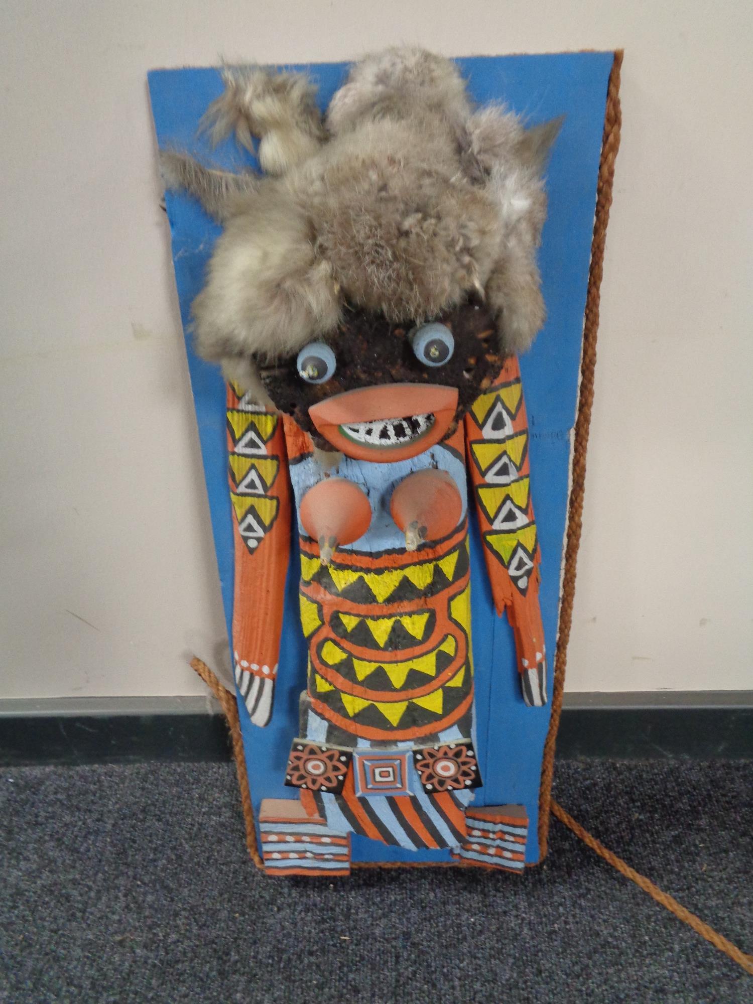 A 20th century hand painted Hopi style figure on wooden board signed G Rethe 67