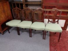 A set of four mahogany shield back chairs