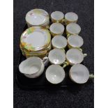 Thirty two pieces of Grafton hand painted tea china