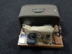 A cased 20th century Jones electric sewing machine