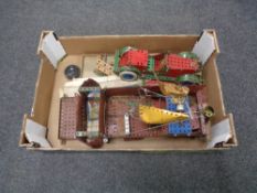 A box containing Meccano pieces