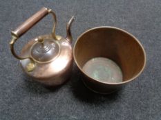 An antique copper and brass kettle together with a copper and brass planter