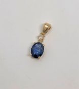 A 14ct gold sapphire and diamond pendant, the sapphire 1.45 carat, the diamond 0.07 carat.