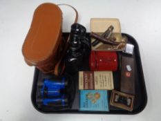 A tray of post office money box, Proloris binoculars, streamline lighter, silver jar lid,