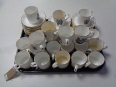 A tray of Royal Crown Staffordshire coffee cans and saucers depicting birds,