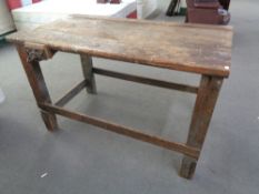 An early twentieth century wood working table fitted a vice CONDITION REPORT: 137cm