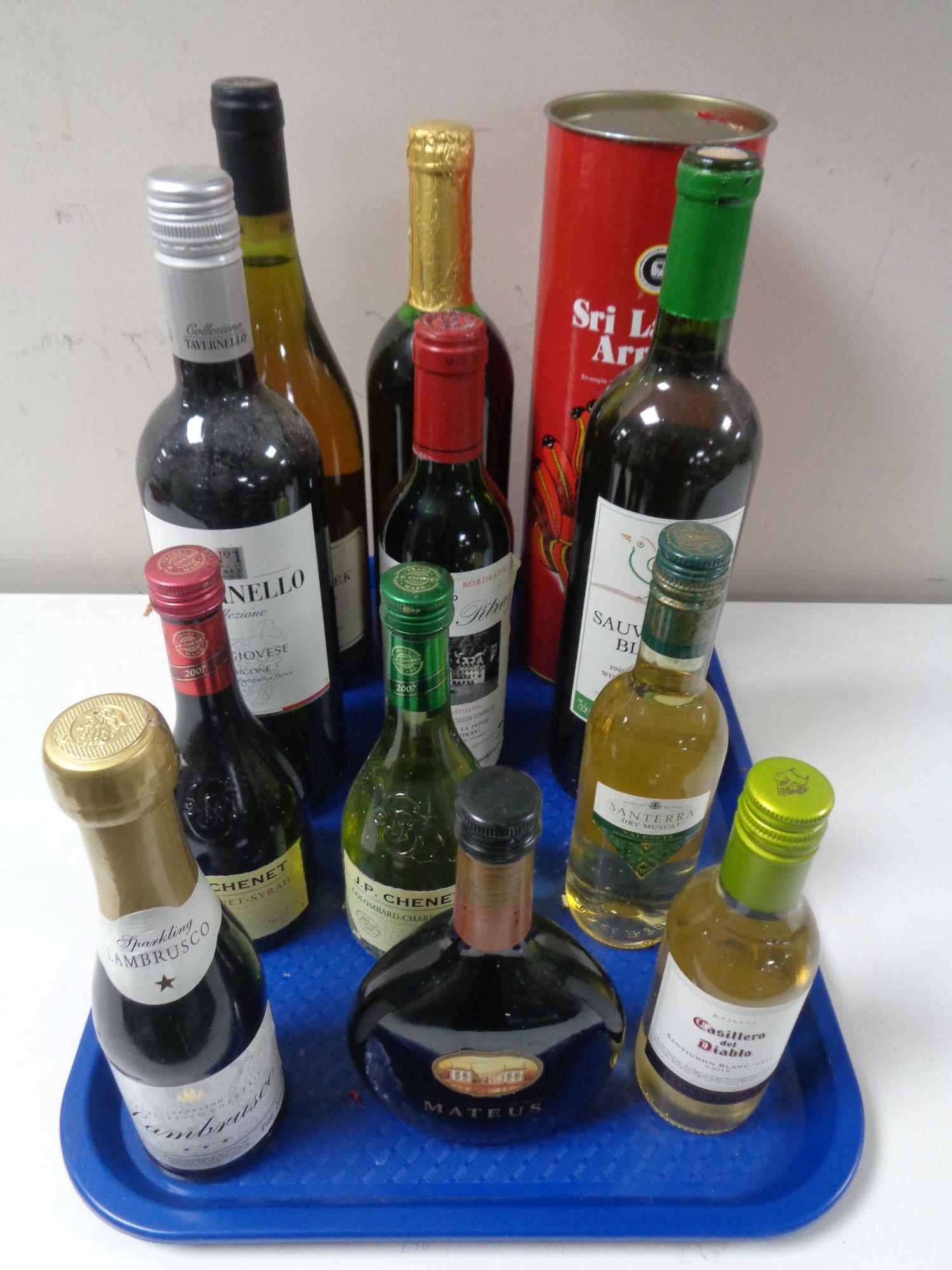 A tray of a eleven assorted bottles of red and white wine together with a bottle of Sri Lanka