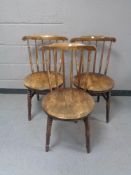 Three spindle back Ikea chairs