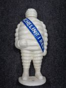 A cast iron door stop modelled as a Michelin Man