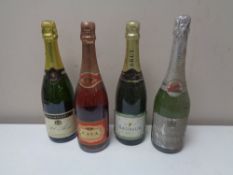 Four assorted bottles of champagne and cava