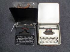 A cased vintage Royal typewriter together with a further brown leather cased Olympia Splendid 66