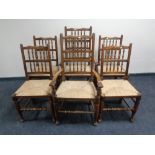 A set of six beech rush seated kitchen chairs comprising two carvers and four singles