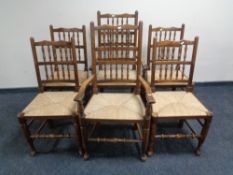 A set of six beech rush seated kitchen chairs comprising two carvers and four singles