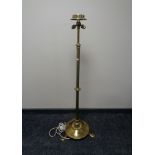 A brass Art Nouveau rise and fall two-way standard lamp