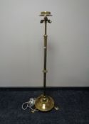 A brass Art Nouveau rise and fall two-way standard lamp