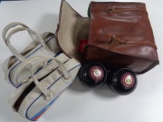 A Slazenger leather lawn bowls bag containing set of lawn bowls and two further sunshine bowls bags
