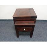 A nest of two contemporary hardwood tables,