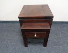 A nest of two contemporary hardwood tables,
