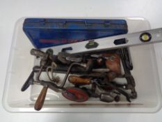 A box of cased Heyco socket set, spirit level, vintage hand tools, brace,