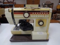 A New Home electric sewing machine with foot pedal