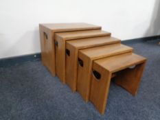 A nest of five Ercol solid elm and beech tables, catalogue no.