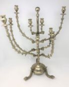 A highly ornate multi branch candelabrum on raised fish supports,