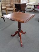An antique stained pedestal wine table