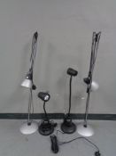 A pair of contemporary angle poised floor lamps and a pair of Ask Series Readers angle poised table