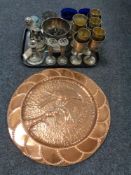 A tray of embossed copper plaque depicting a bird, plated goblets,