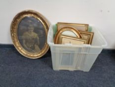 A box containing early 20th century framed monochrome photographs and black and white etchings