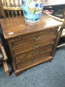 A mahogany Regency style four drawer chest with slide