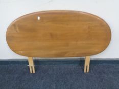 An Ercol solid elm and beech 3' headboard