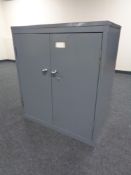A metal two drawer stationary cabinet