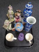 A tray of continental figurines, Japanese lidded sugar bowl, Caithness vase, Melba ware,