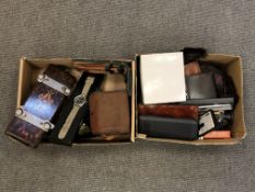 Two boxes containing gent's leather wallets, pens, tie press,