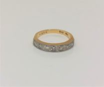 An 18ct gold seven stone half eternity diamond ring, approximately 0.5ct, size M/N.