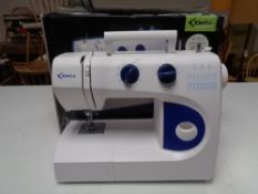 A boxed Delta electric sewing machine