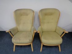 A pair of Ercol solid beech double-bend tall back easy chairs, catalogue no.