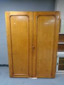 A Victorian double door gentleman's wardrobe fitted internal trays and shelves,