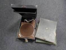 A 20th century table top portable HMV gramophone together with two cases of 78's