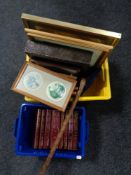 Two plastic crates of assorted framed pictures, plaster wall hanging,