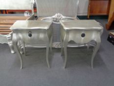 A pair of silvered bedside stands fitted a drawer