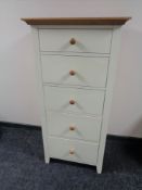 A contemporary painted pine five drawer chest