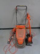 A Flymo turbo compact 300 hover vacuum together with an Easi trim,