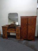 A 1930's walnut double door gent's wardrobe together with kneehole dressing table and triple mirror