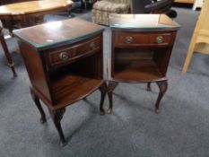 A pair of mahogany glass topped bedside stands fitted a drawer