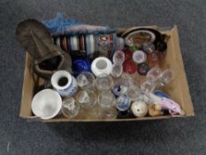 A box of woolen rug, assorted glass ware, figures,